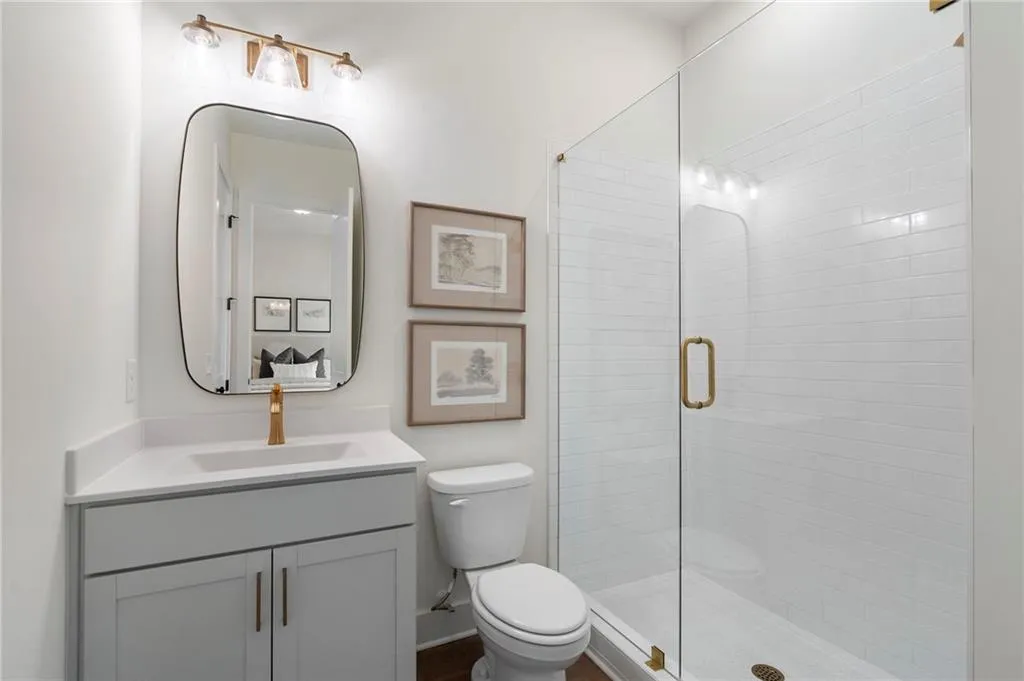 Full bathroom with vanity and a stall shower
