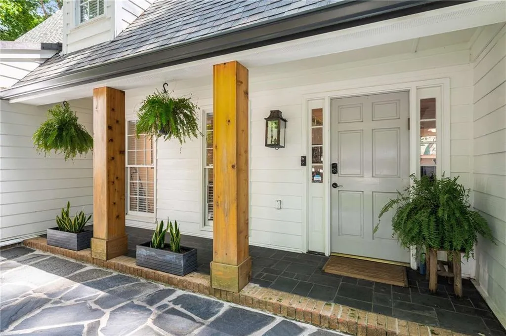 Property entrance featuring covered porch