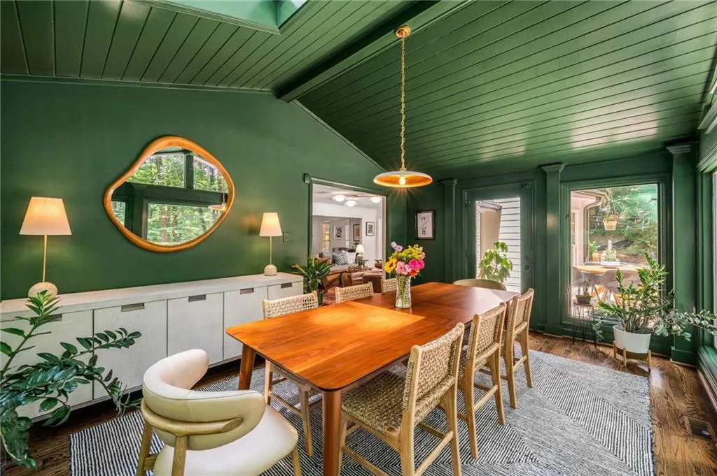 Dining space featuring plenty of natural light, wooden ceiling, and wood finished floors