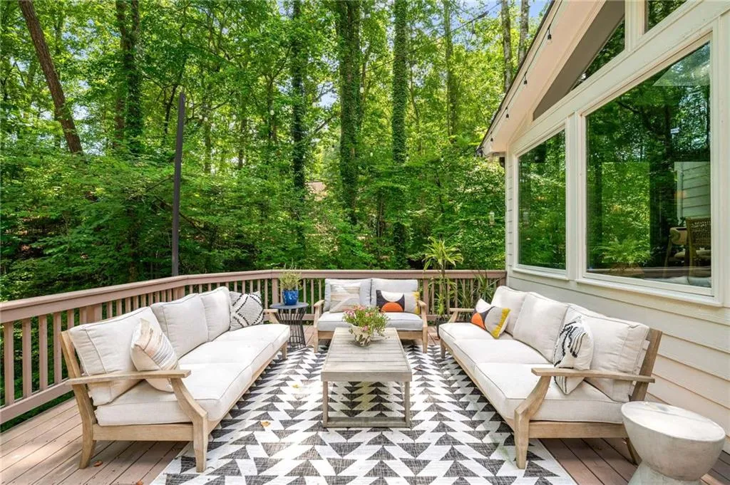 Wooden deck featuring an outdoor living space