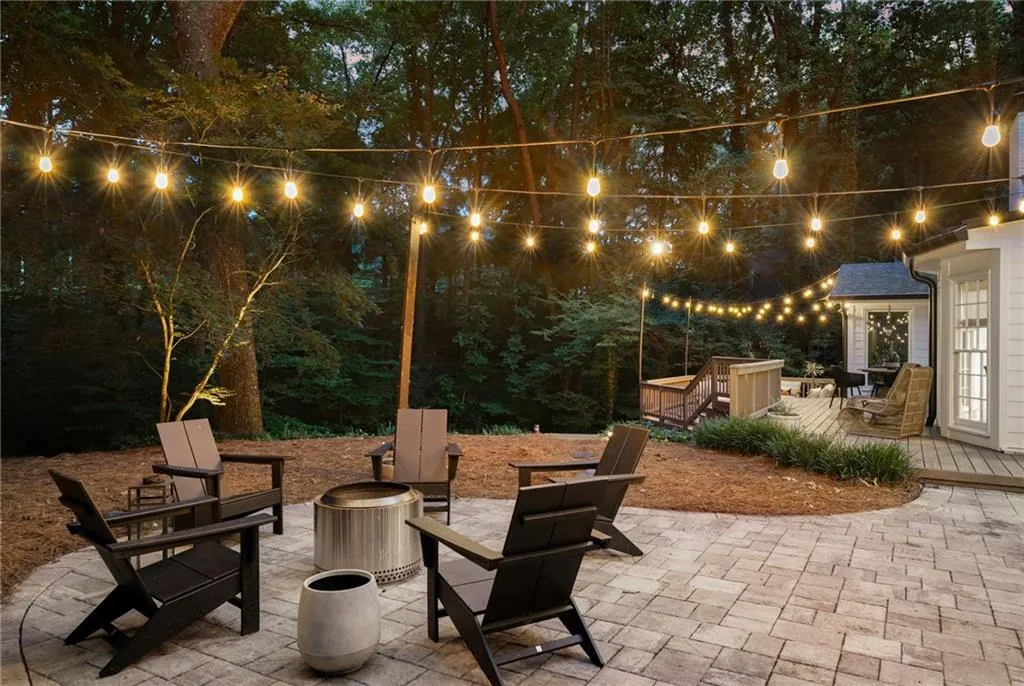 View of patio / terrace with an outdoor fire pit and a wooden deck