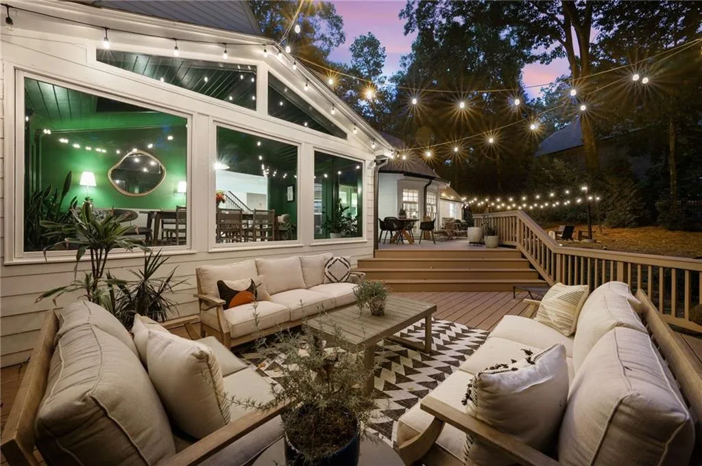 Deck at dusk featuring an outdoor hangout area