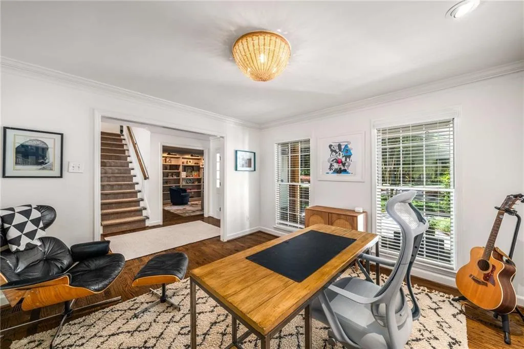 Office with crown molding and wood finished floors