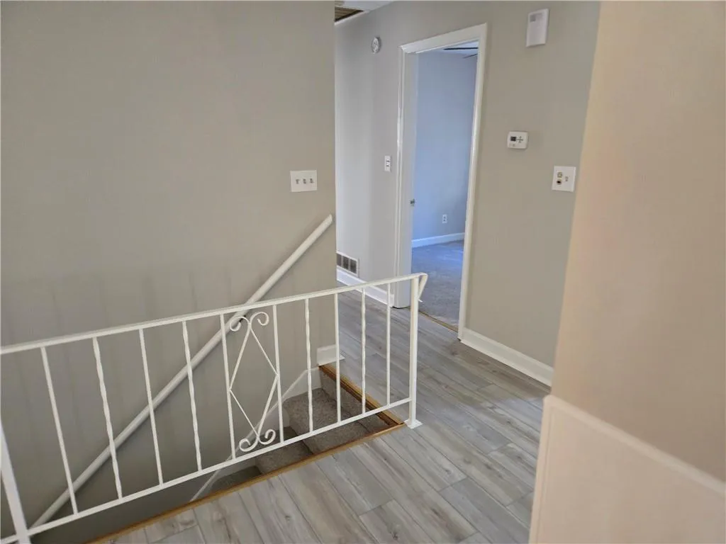 Hallway featuring wood-type flooring