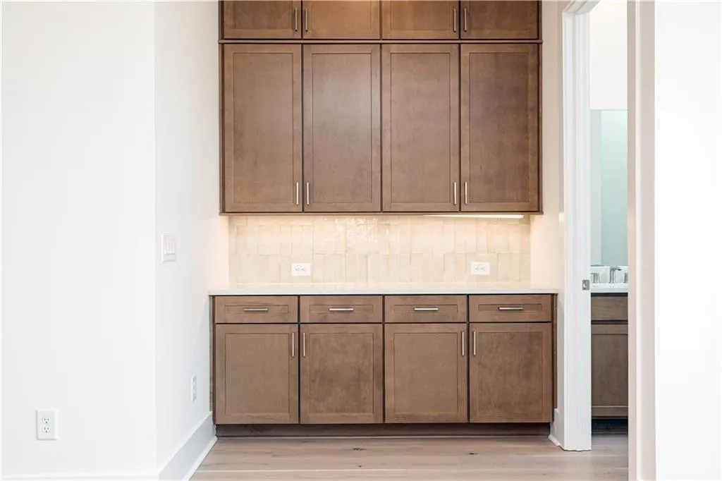 Dry bar with extensive cabinet storage.