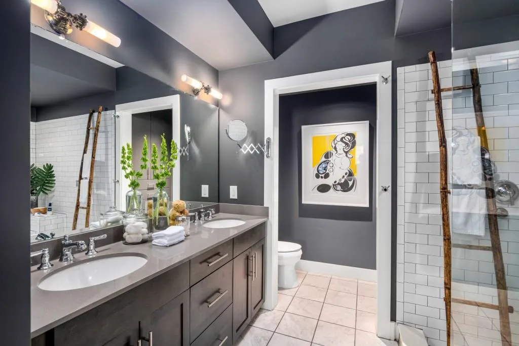 The Primary Suite offers a serene retreat with a spa-inspired wet room that combines a deep soaking tub and frameless glass shower into one indulgent space.