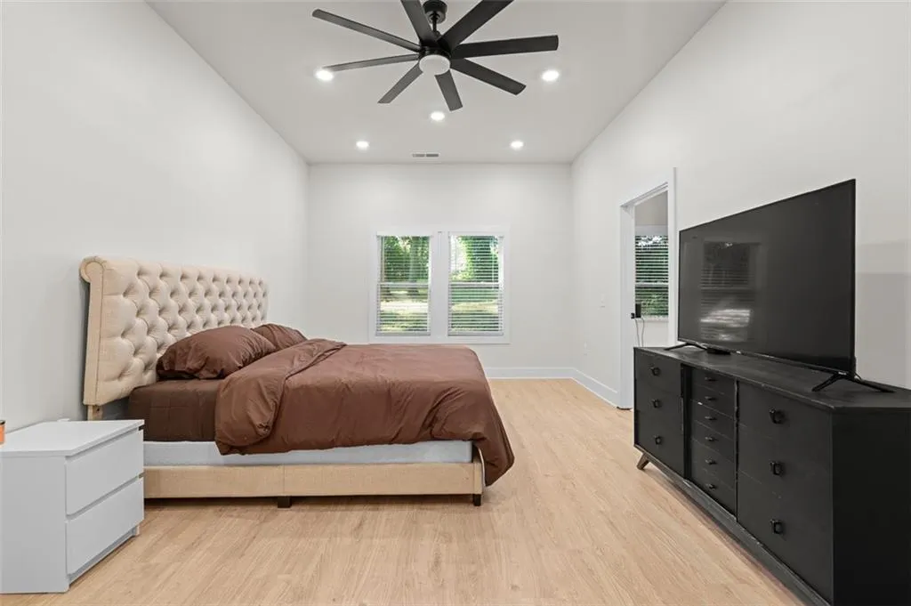 Bedroom featuring recessed lighting, light wood-style flooring, and ceiling fan