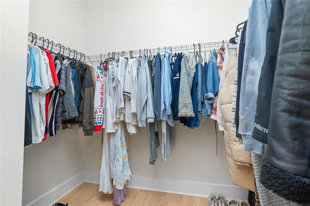Walk in closet featuring light wood-type flooring