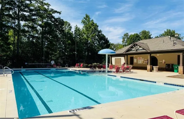 Resort-style swimming pool with dedicated lap lanes and surrounding hardscaping