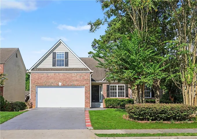 Brick and siding exterior with a gabled roofline