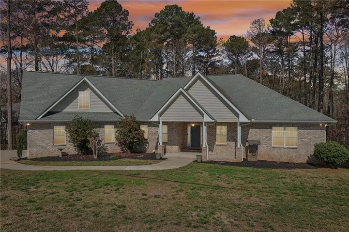 Brick exterior with gabled roof lines and shingle siding accents