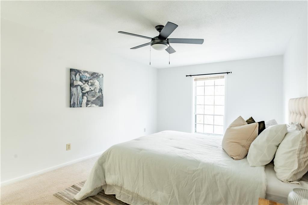 Bedroom with carpet floors and ceiling fan