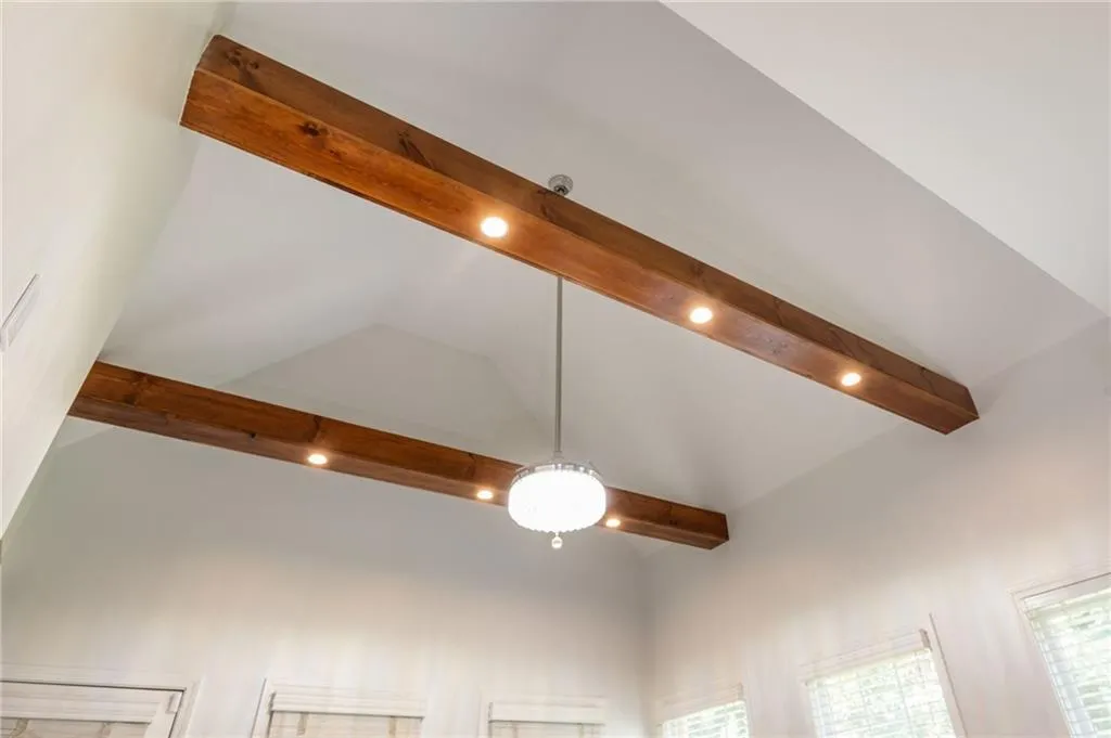 Detailed view of beamed ceiling and ceiling fandeliar