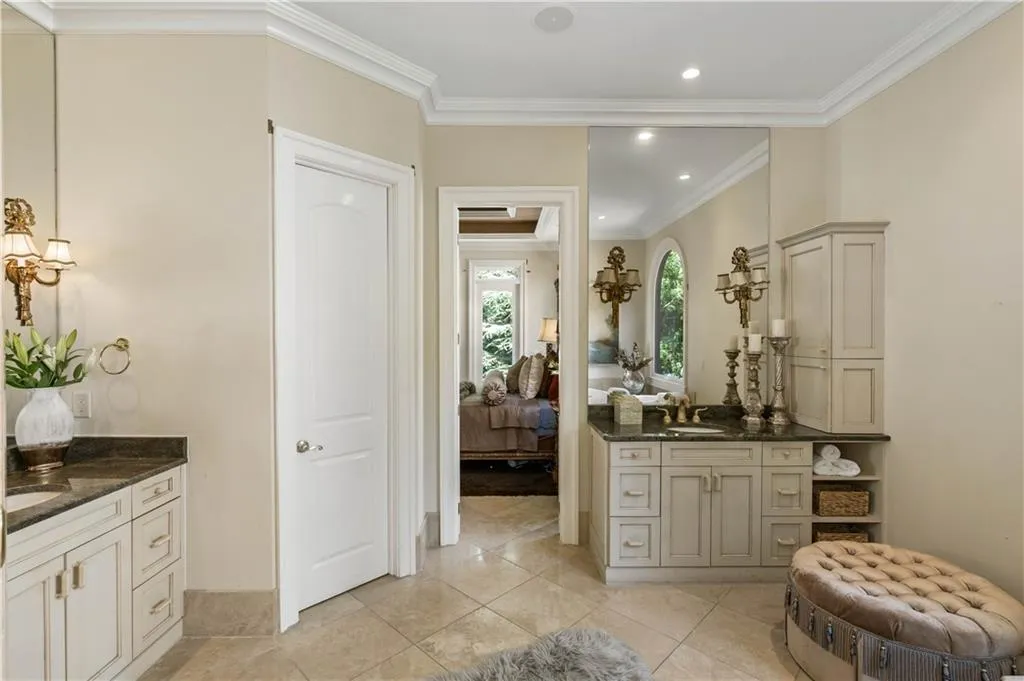 Bathroom featuring ornamental molding, vanity, and tile patterned floors