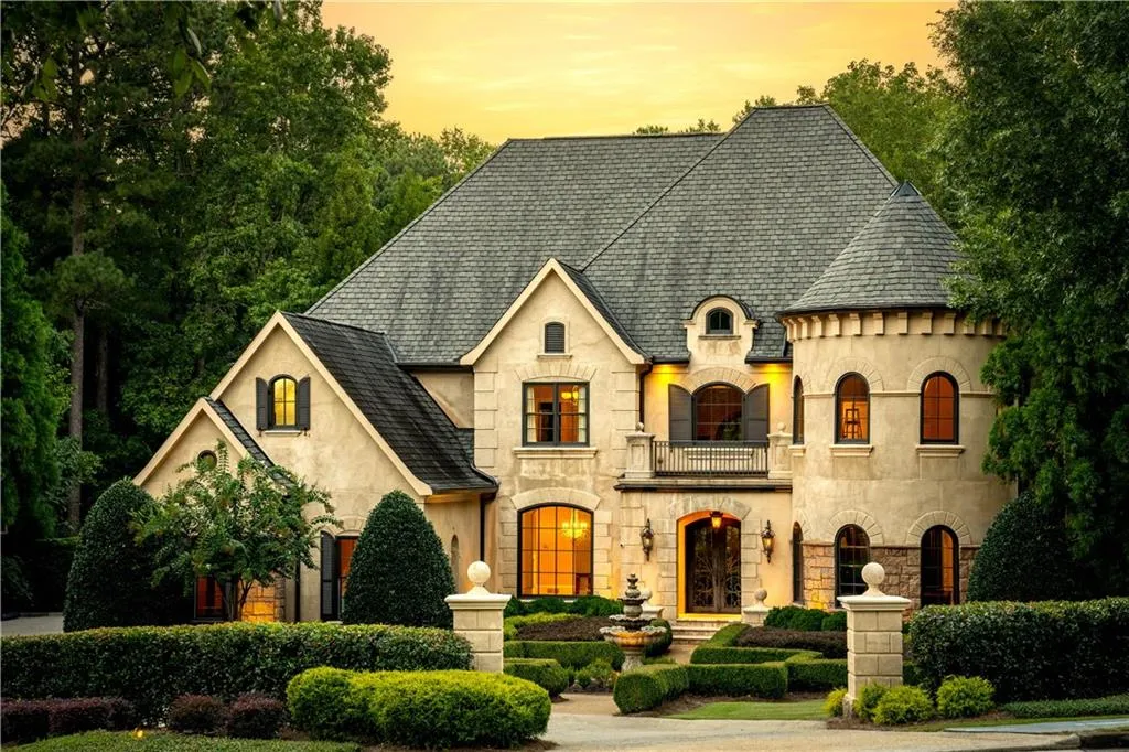 French country inspired facade featuring a balcony