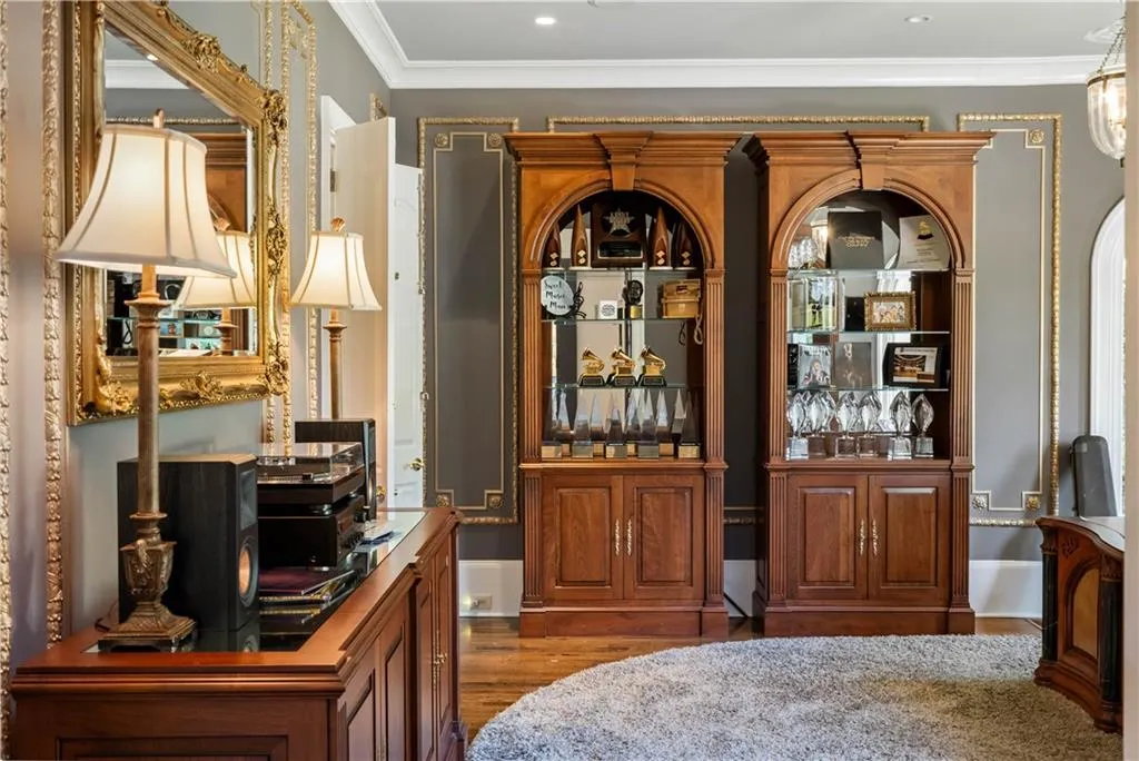 Home office with crown molding and dark hardwood / wood-style floors