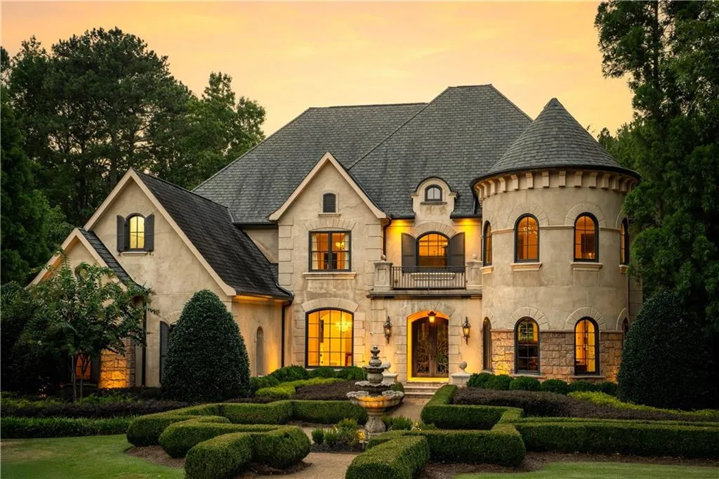 French country inspired facade with a balcony