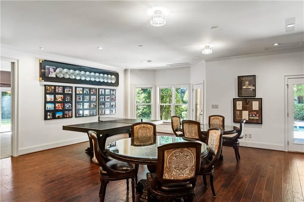 Dining room featuring crown molding and dark wood-type flooring