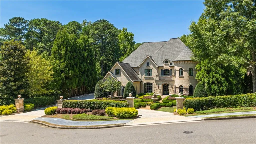 French country home featuring a balcony