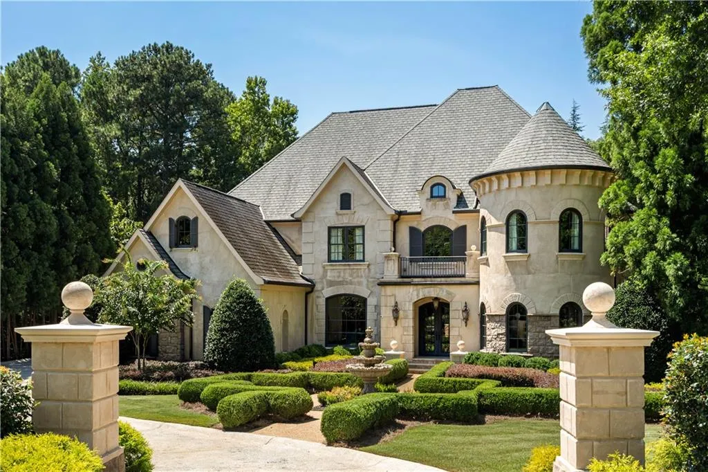 French provincial home with a balcony