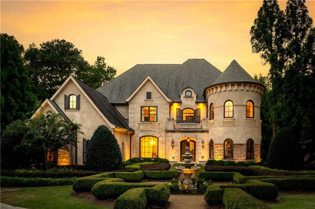 French country home featuring a balcony