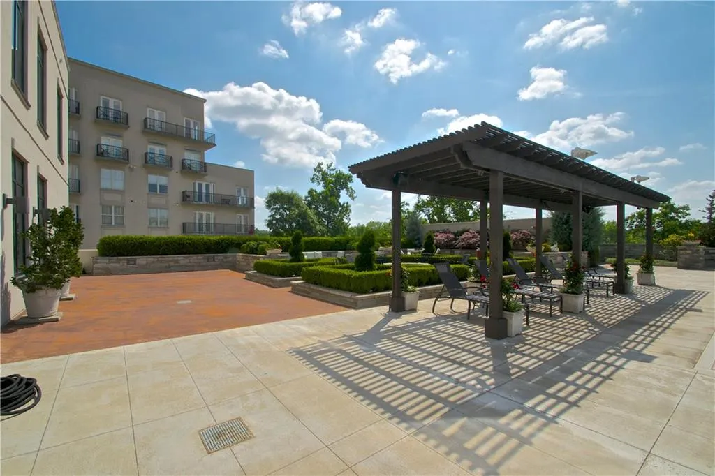 View of property's community featuring a patio area and a pergola