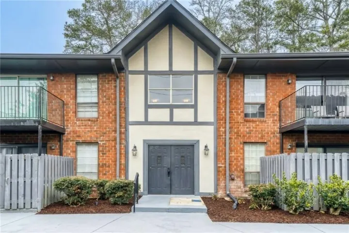 Brick and siding multi-level exterior with dormer accents