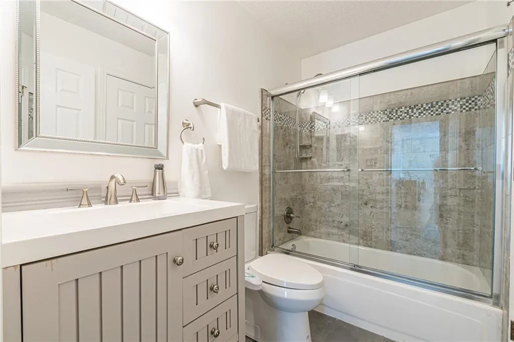 Fully updated bathroom- shower tile, vanity, and flooring.