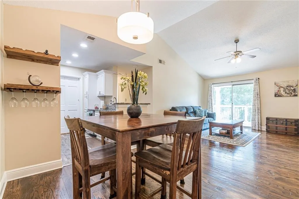 Dining area with added bar fixture on wall