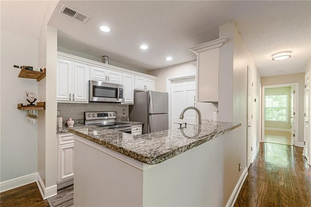 Open kitchen with recessed lighting