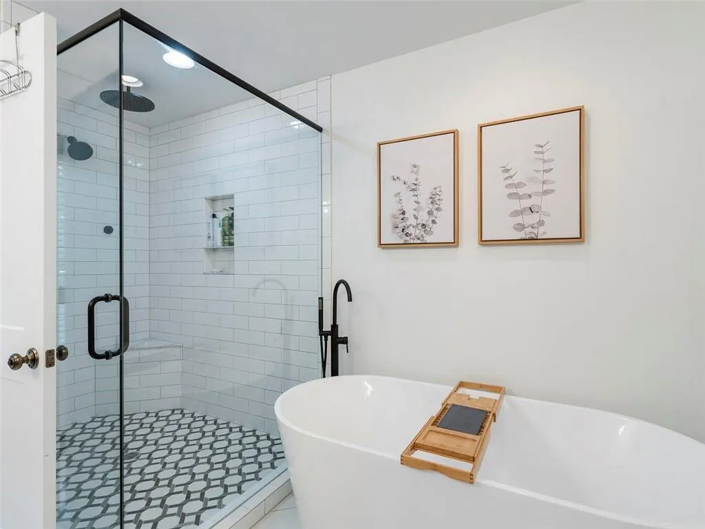 Bathroom featuring shower with separate bathtub