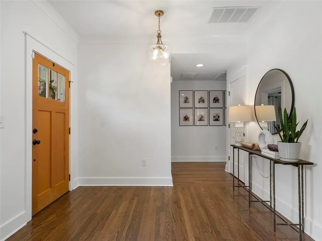 Foyer entrance with dark wood-type flooring