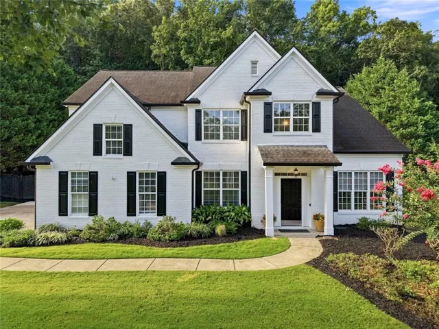 Painted brick exterior with gabled roof lines