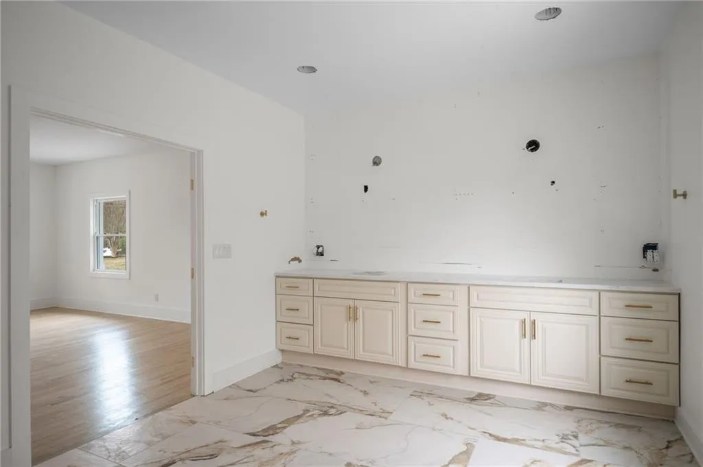 Bathroom featuring vanity and wood-type flooring