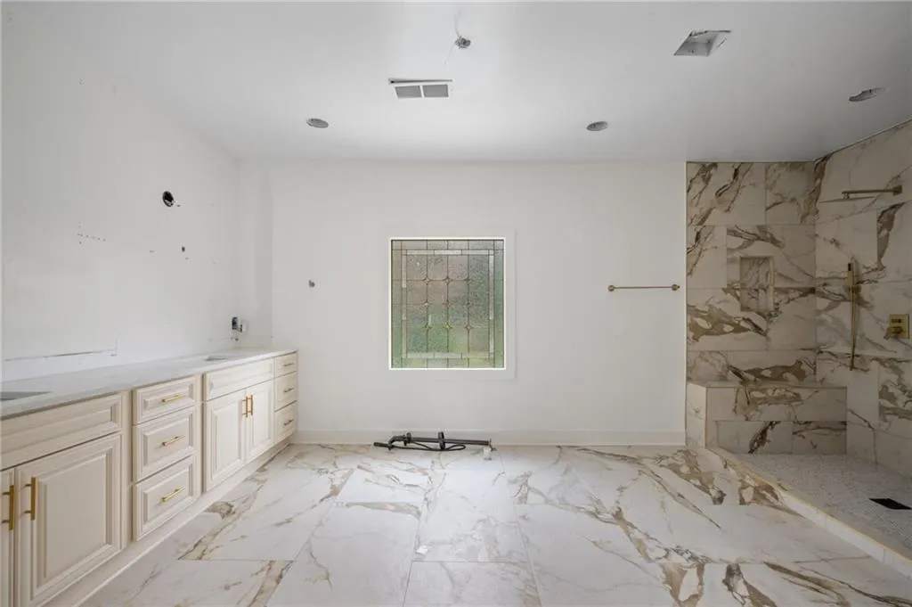 Bathroom featuring vanity and walk in shower