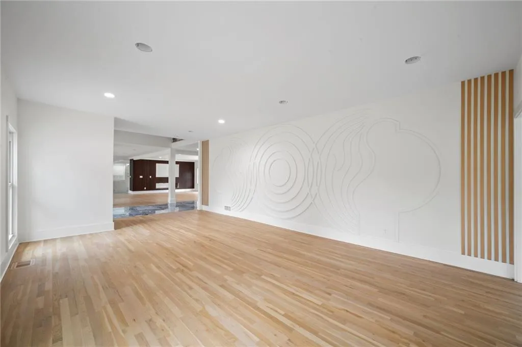 Unfurnished living room featuring light hardwood / wood-style flooring