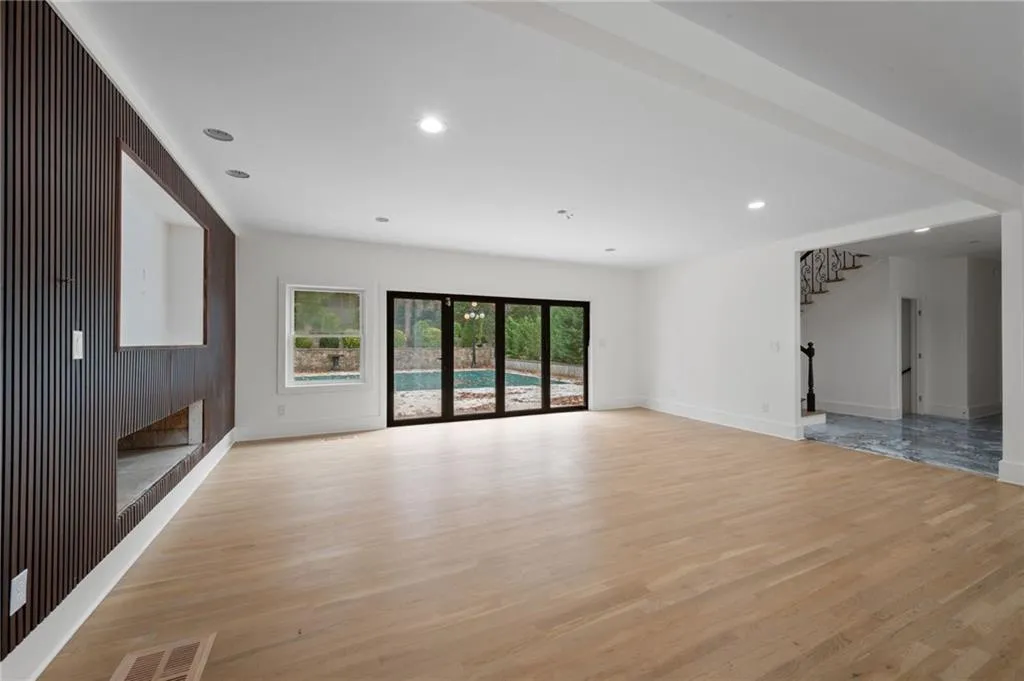 Unfurnished living room featuring light wood-type flooring
