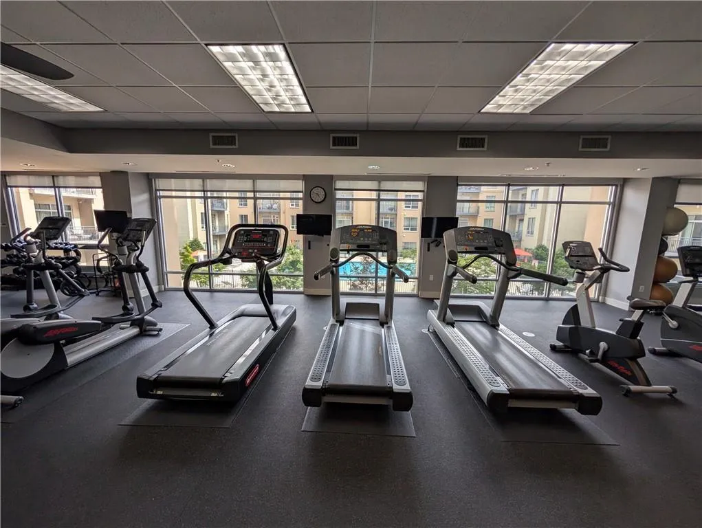 Gym with a paneled ceiling