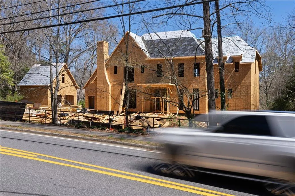 View of front facade featuring a chimney
