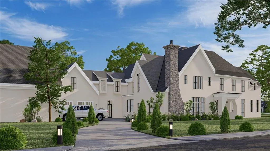 French country home with a front lawn, stucco siding, and a chimney