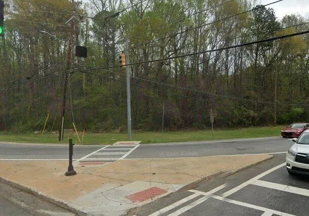 View of asphalt street with curbs
