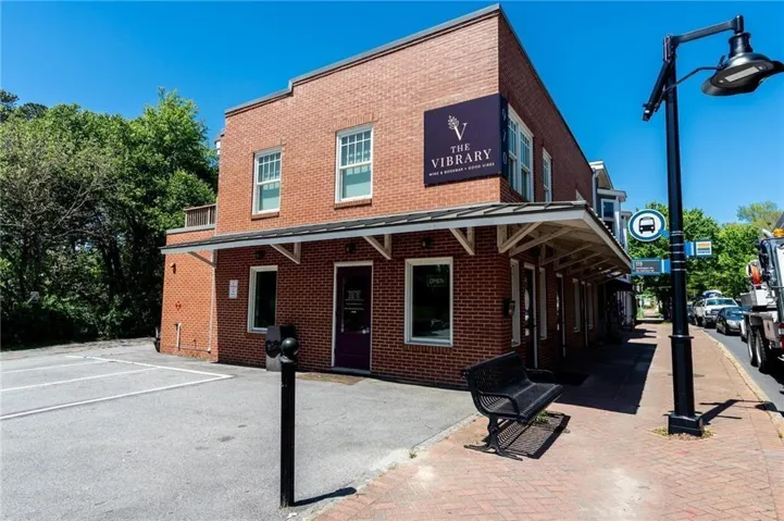 Highly desirable corner lot location, with it's own parking! Very rare on Main St.