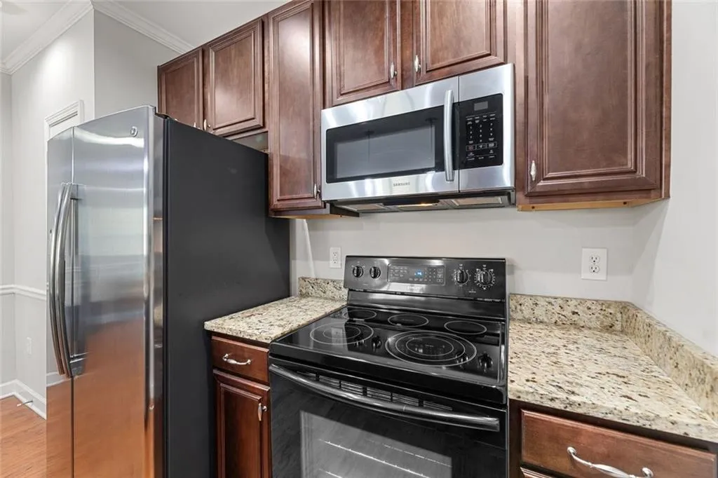 Kitchen with electric range and microwave
