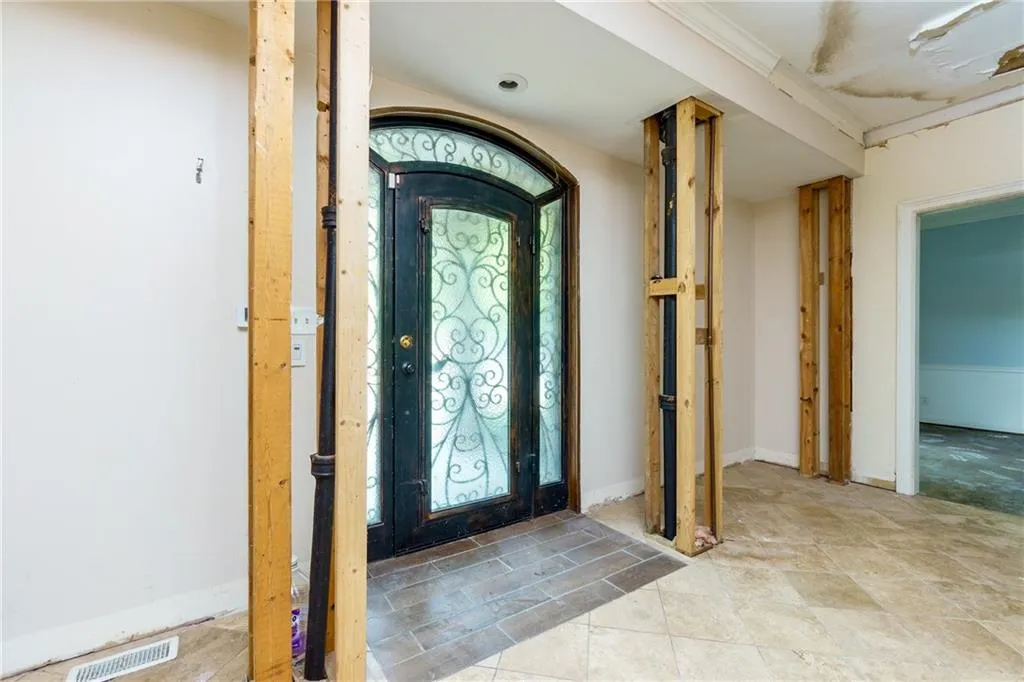 Entryway with tile patterned flooring