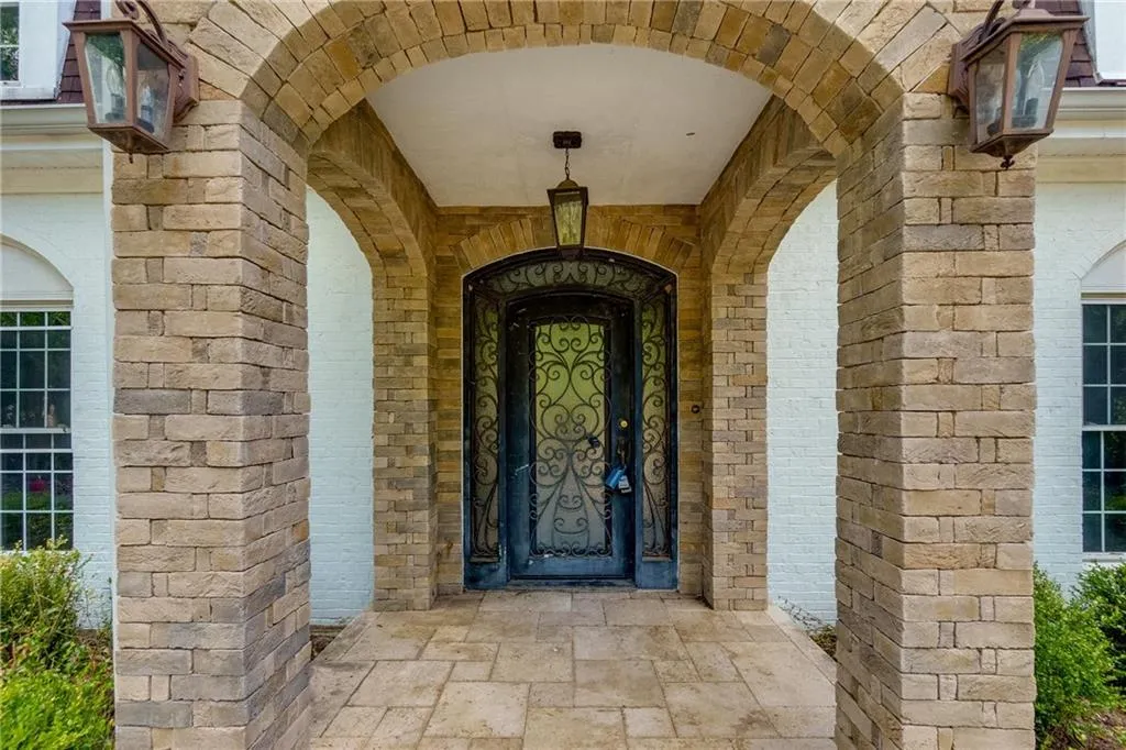 Entrance to property with brick siding