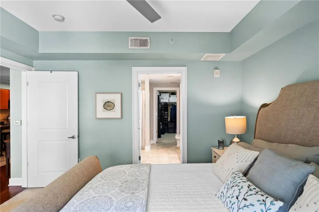 Tiled bedroom with ceiling fan