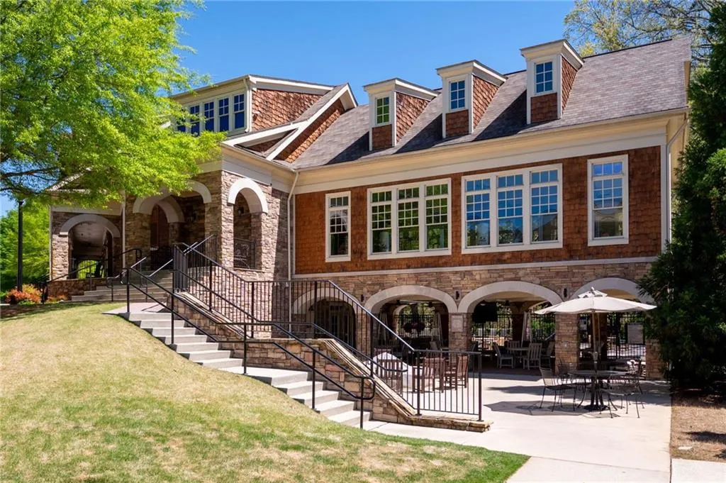 View of front of home with a front lawn and a patio