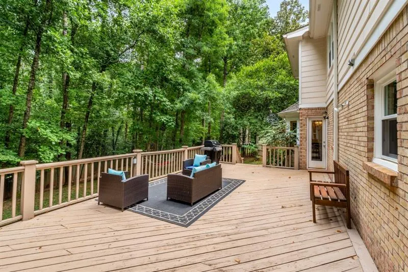 Huge rear deck overlooks the expansive backyard.