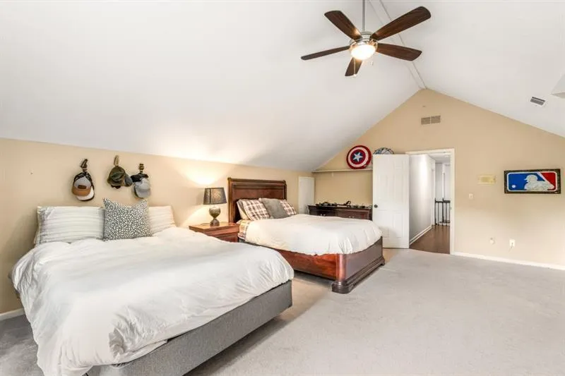 This vast upstairs bedroom is a perfect in-law or teen suite - with its own set of stairs.