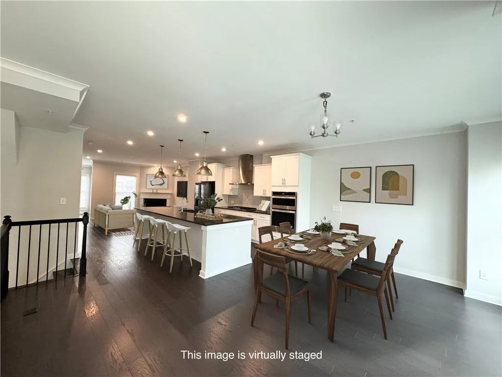 Dining space featuring recessed lighting, dark wood-type flooring, a chandelier, and crown molding